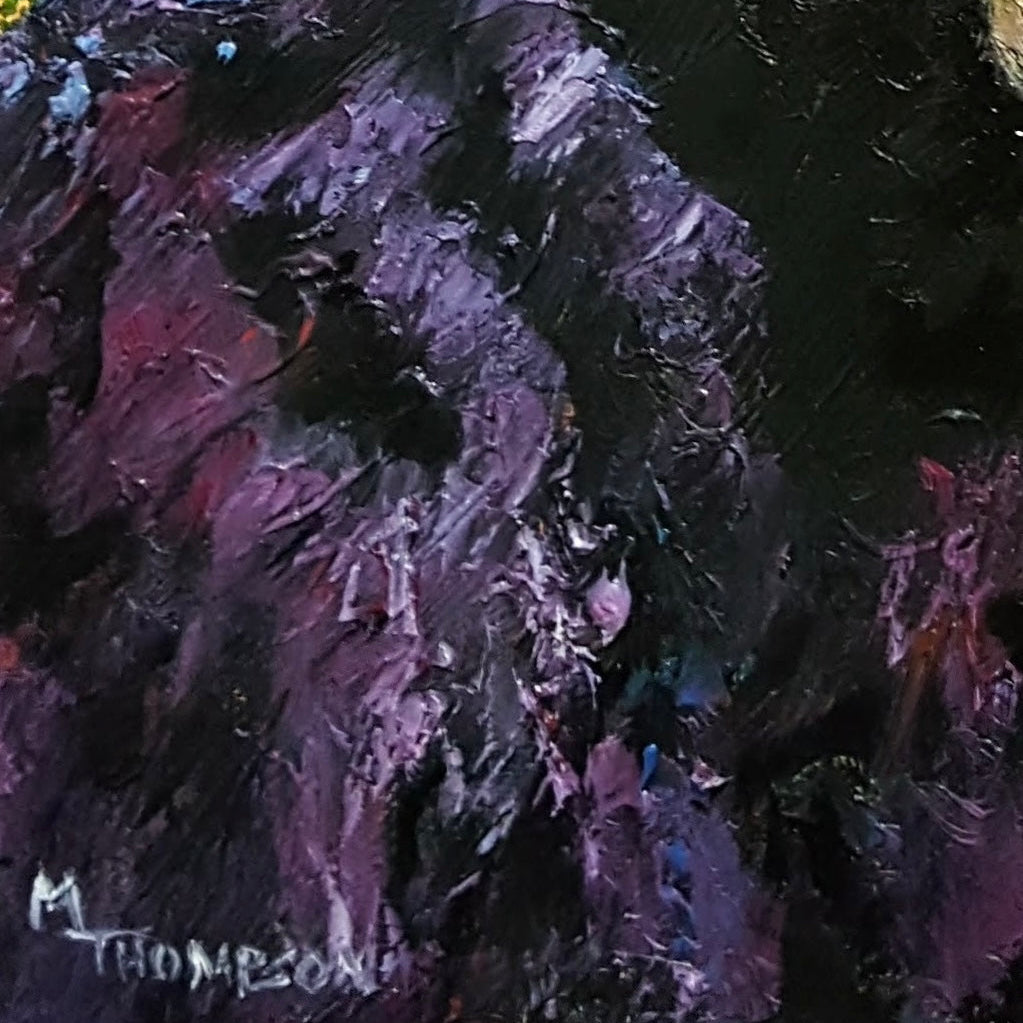 Close-up of an abstract painting with purple and black tones.