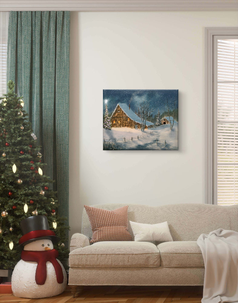 Living room with a Christmas tree, snowman, and framed winter landscape painting on the wall.
