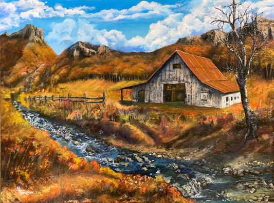Painting of a rustic barn by a stream with mountains in the background