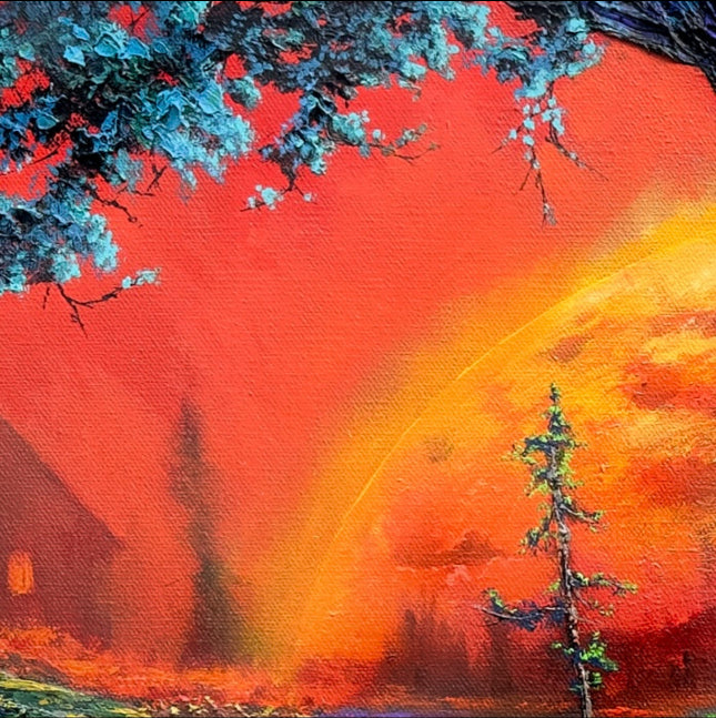 Surreal landscape with trees, house, and rainbow against a red sky