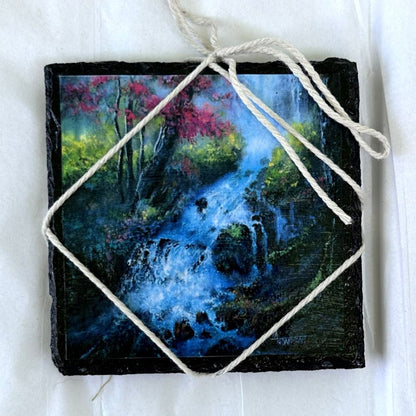 Artistic depiction of a forest scene with a stream on a small slate stone, tied with twine.
