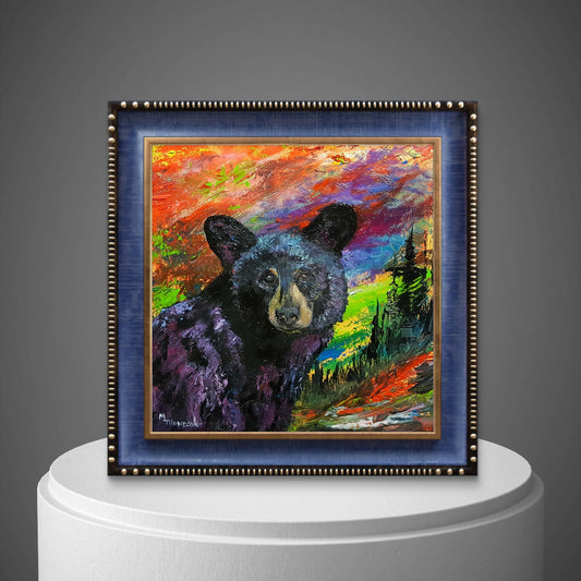 Framed painting of a bear with a colorful background on a gray background