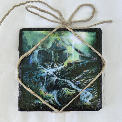 Decorative coaster with nature-themed waterfall design tied with twine on a white background                                                                                                      