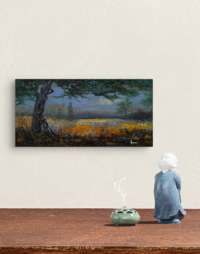 Person in a blue robe standing in front of a painting of a landscape with “The Old Wise Tree” by Michael Thompson 